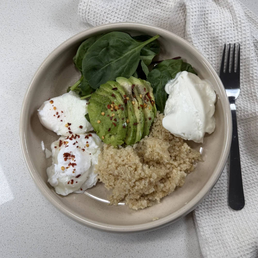 Poached eggs, avocado, quinoa and greens
